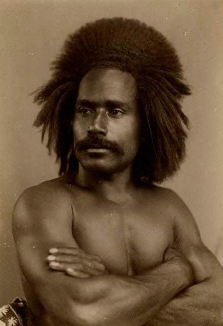 Studio portrait of a Fijian man, arms crossed