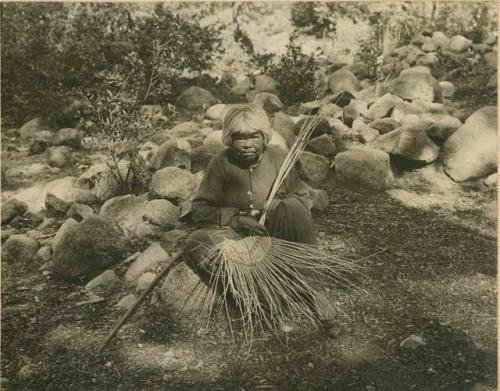 Old woman weaving a basket; Yosemite Park