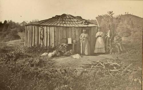 Three Me-wuk woman standing in front of Rancherie