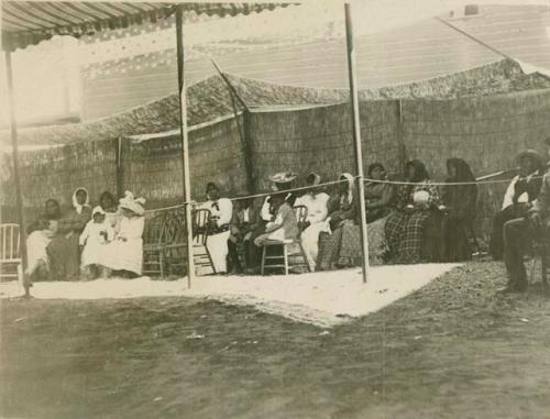 Pomo Indians sitting, watching dance; Ukiah, California