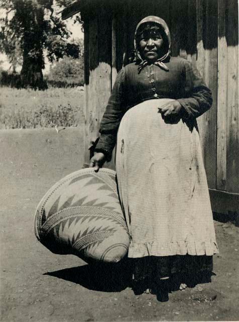 Sallie Jack, Lower Lake, holding large basket