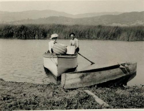 Grace Nicholson and man with baskets on Clear Lake