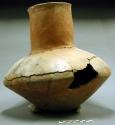 Medial shouldered jar; fairly wide mouth, tall neck, body & neck repaired; chipp