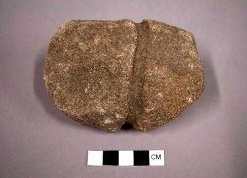 Grooved partially formed stone tool