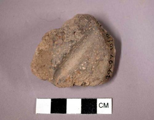 Grooved worked stone fragment