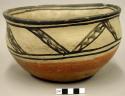Painted pottery bowl. Bird and tree design inside; geometric design outside.