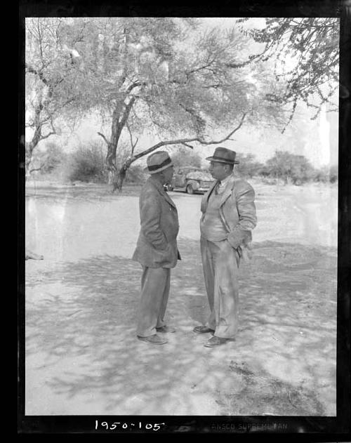 Laurence Marshall and John Neser standing together, talking