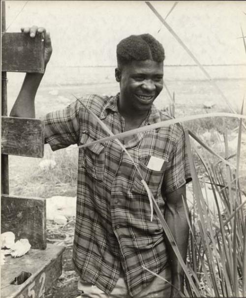 Jim Rudolf (brother of Franz Rudolf) standing next to an expedition truck