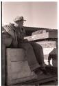 Heinrich Neumann sitting on a box on an expedition truck