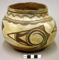 Jar, polacca polychrome style c. zuni rain bird design. 13.5 x 17.2 cm.