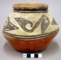 Jar, polacca polychrome style c. zuni rain bird design. 13.0 x 16.5 cm.