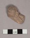 Pottery figurine foot with sandal