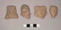 Pottery figurine heads; buff colored fired clay; single faced molds; slit eyes