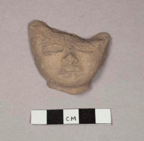 Pottery figurine head fragments