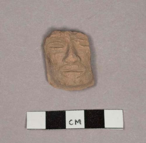 Pottery figurine head fragments