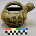 Complete ceramic effigy vessel, bird, single handle, black & red on plain burnis