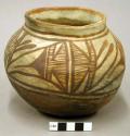 Jar, polacca polychrome style c. linear design. 12.5 x 15.0 cm.