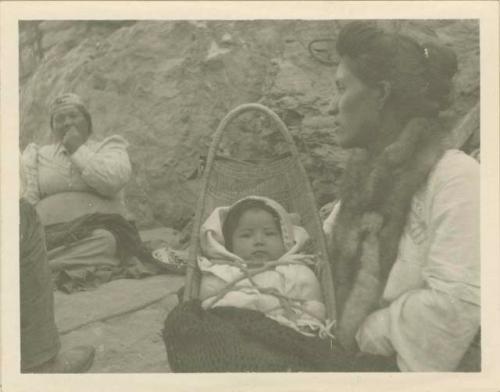 Mrs. Sam Jones, her baby and her mother. The two women being fine weavers of Klamath, California