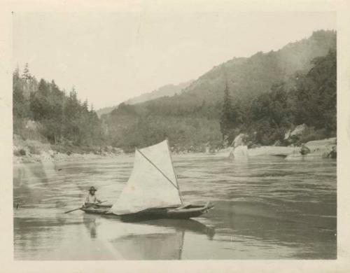 Man in a hat sailing up the Klamath