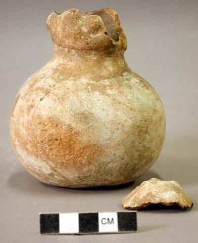 Ceramic effigy bottle, owl? Head broken, 1 sherd inside.