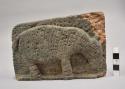 Ground stone effigy plaque, human with birds on front, oppossum on back.