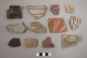 Misc. sherds of various colors - one with lug
