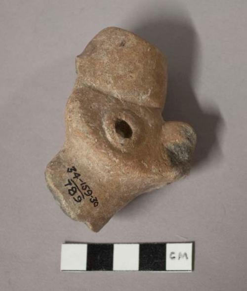 Pottery vessel spout, animal head