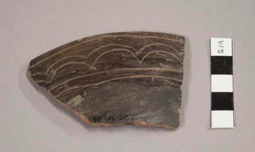 Dark incised potsherds