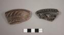Black incised potsherds with background cut away, from low dishes incised on bot
