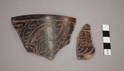 Black incised potsherds