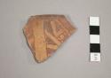 Tan rim potsherd - incised and background cut away - red pigment in lines - Type