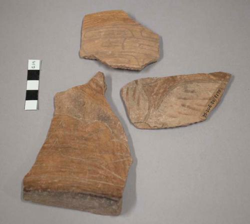 Light incised potsherds-partly polished