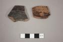 Black incised potsherds