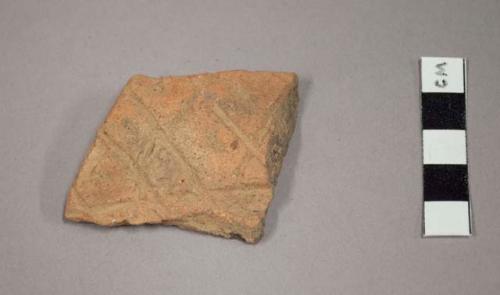 Rim potsherd - criss-cross incising with dots between - on outside of bowl