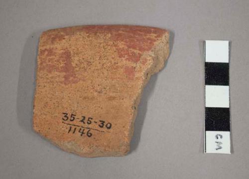 Rim potsherd - small plate (?), red painted band on under side