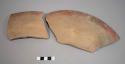 Rim potsherds of large shallow bowl, red painted band outside