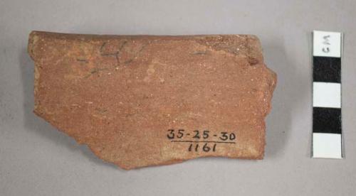 Rim potsherd - flat lip, incised on top, curved on under side