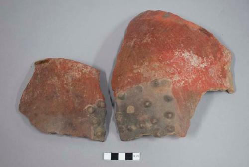 Three sherds of large pottery jars (one restored)