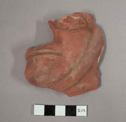 Fragment of vase, human face