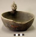 Ceramic complete effigy bowl, human form, part of rim broken off, three incised