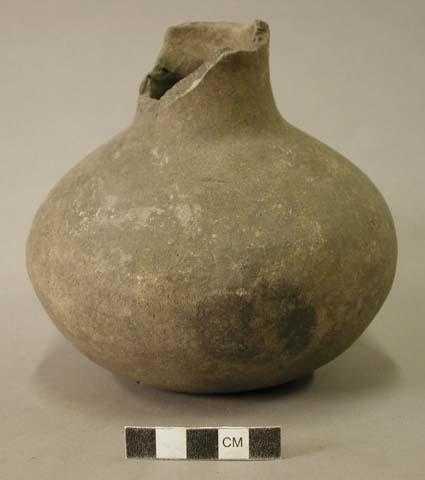 Ceramic vessel, long neck, neck partially broken off, hole in body