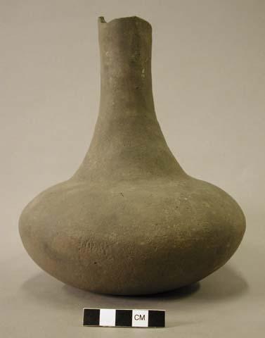 Ceramic vessel with long neck.