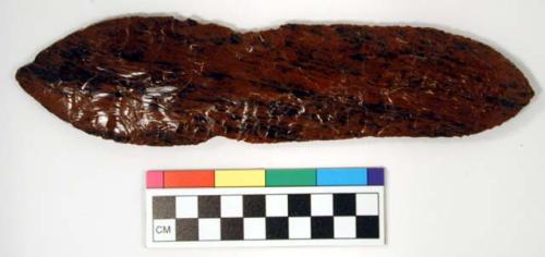 Chipped implement, red & black mottled obsidian