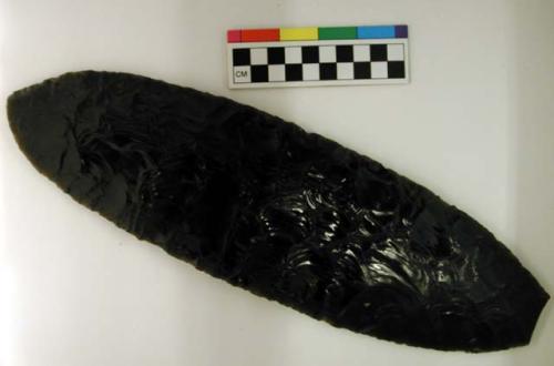 Chipped implement; chipped from black obsidian