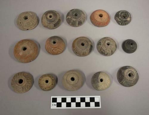 Terra cotta spindle whorls