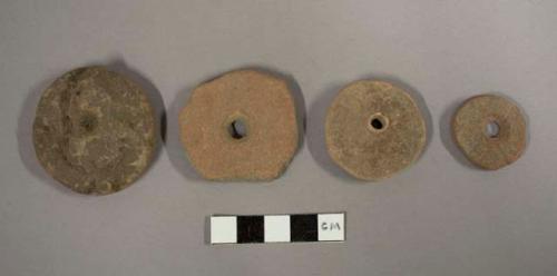 Flat plain pottery spindle whorls