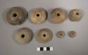 Pottery spindle whorls with incised decoration