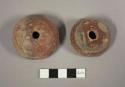Large red pottery spindle whorls