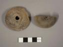 Incised pottery spindle whorl