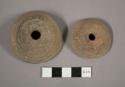 Large pottery spindle whorls with incised lines